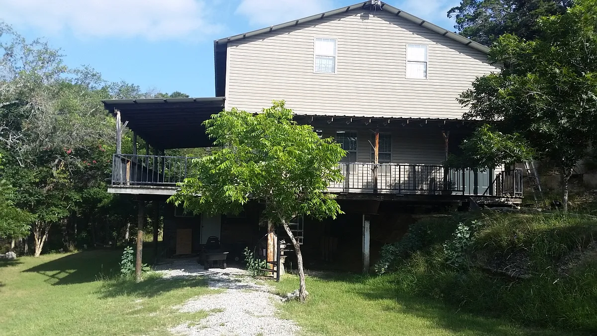 Carport parking with storage unit below - Indian Mound Rd