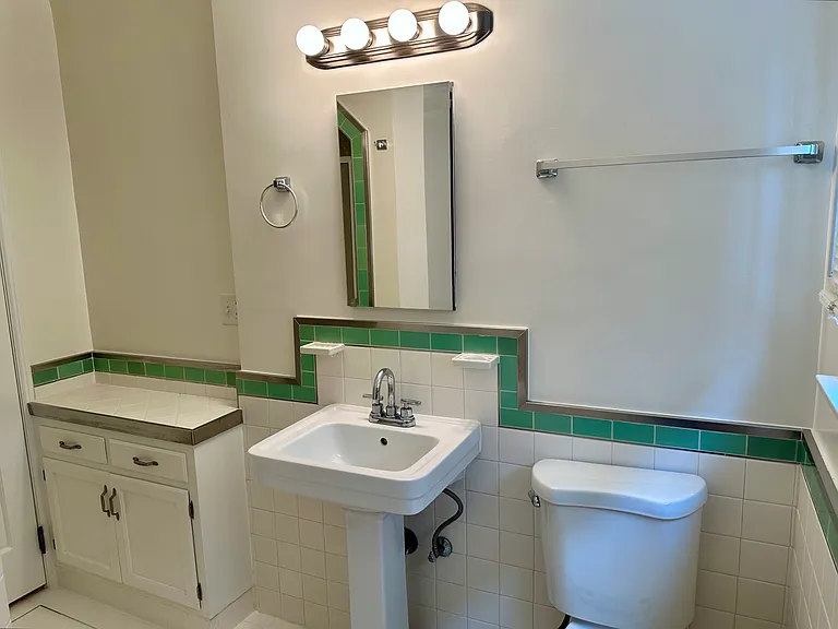 Vintage meets modern kitchen with cool green tiling