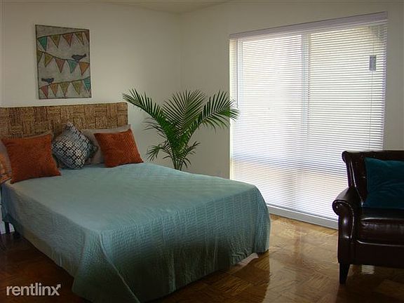 Renovated bedroom with parquet flooring
