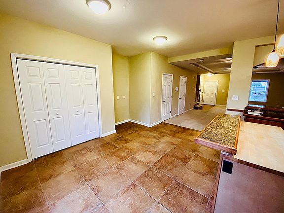 Dining Room with the view of pantry, office nook, and kitchen bar seating w/ butcher board!