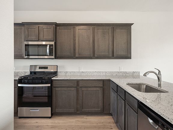 The kitchen of the Sterling has sprawling granite countertops.