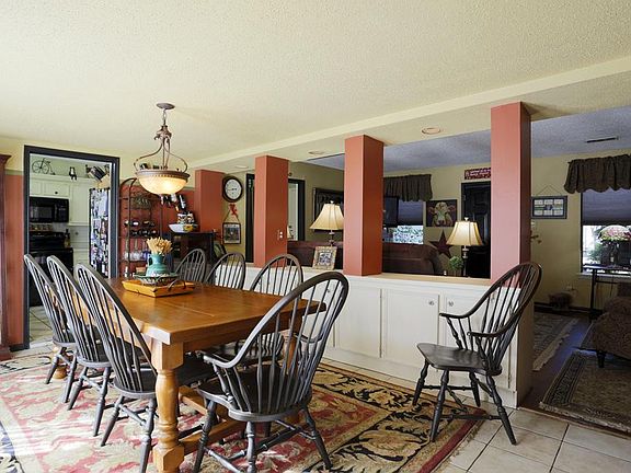 The formal dining room has tile flooring and storage for special serving pieces.