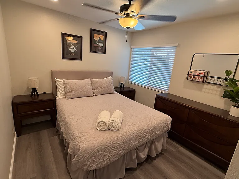 Bedroom 3 with recessed lighting and fan/light with window facing the private patio yard and 6 ft closet