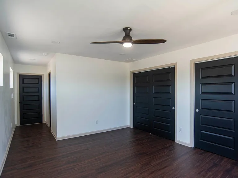 Large bedroom overlooking backyard