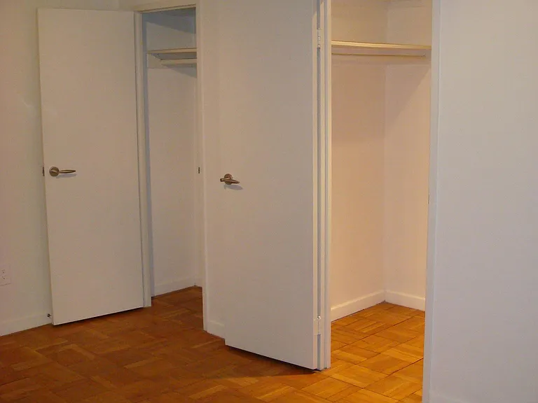 Bedroom features lots of closet space including a walk-in closet.