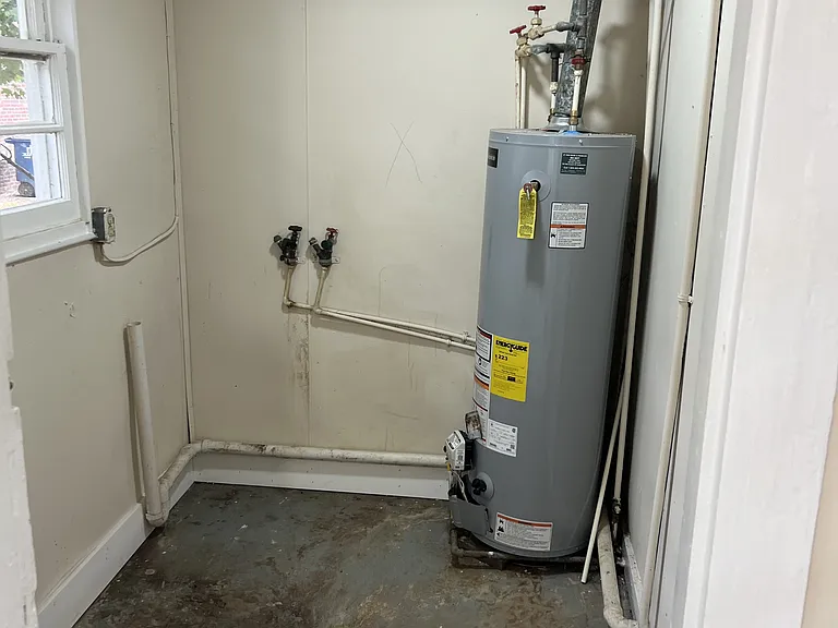 Utility room- Washer and dryer hookup - New gas hot water heater August 2024
