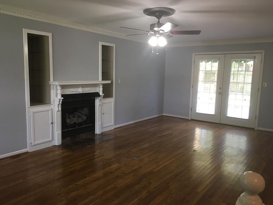 Living room with built-ins and fireplace