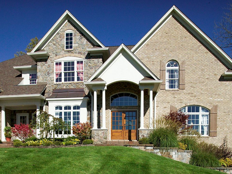 Curb Appeal Galore - stone/brick and column porches 