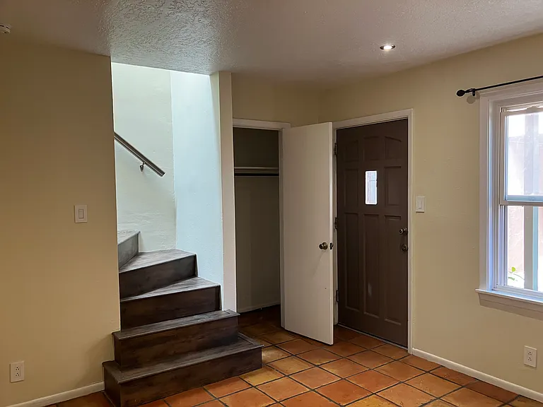 Living room: staircase leading to bedrooms