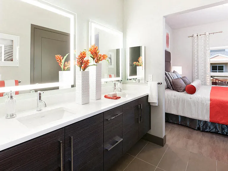 Double vanity sinks with edge lit vanity mirrors with built in HDTV