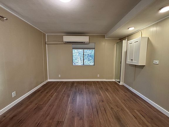 Living area with bed space on the right