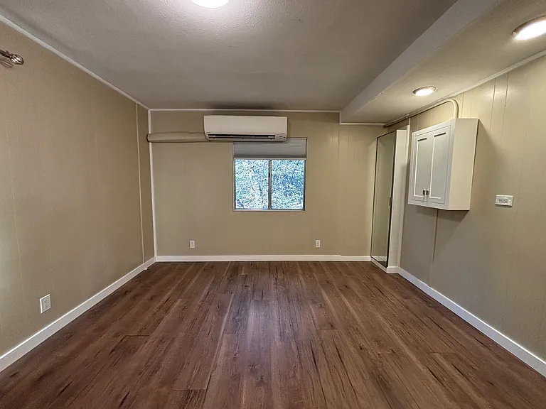 Living area with bed space on the right