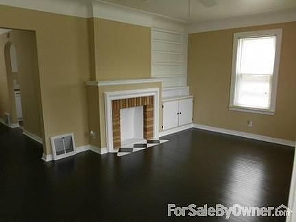 Living Room
						:
						Camel walls, dark chocolate wood floors and bright white trim & doors