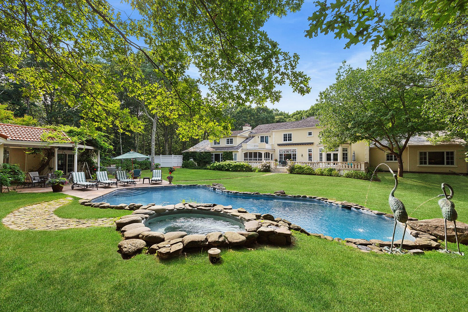  Surrounded by four acres of natural beauty in the Grace Estate
