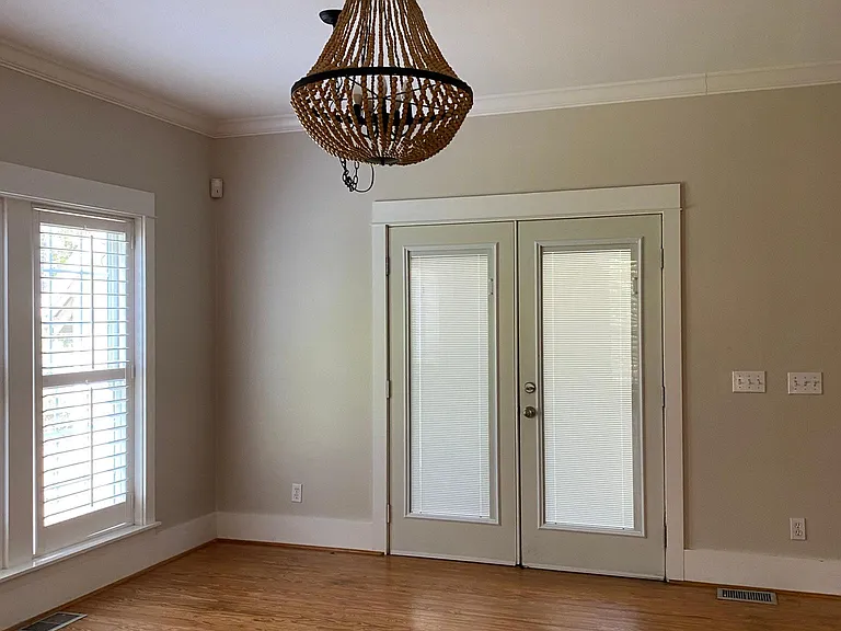 Dining area opens to back, screened porch.