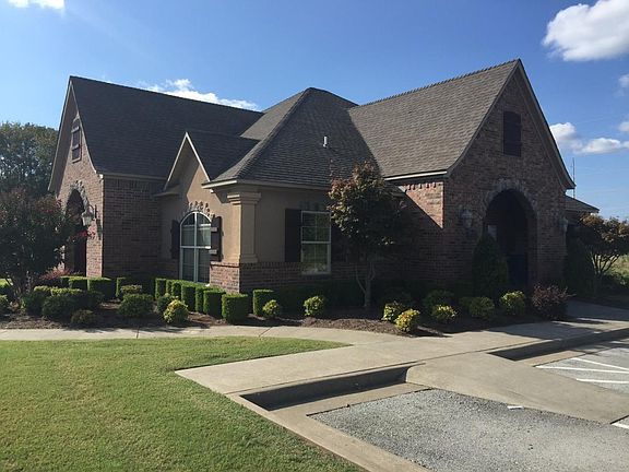 Clubhouse with fitness center, large gathering area, big scr