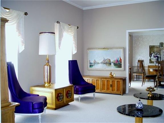 Formal Living opens to Foyer and Formal Dining area.