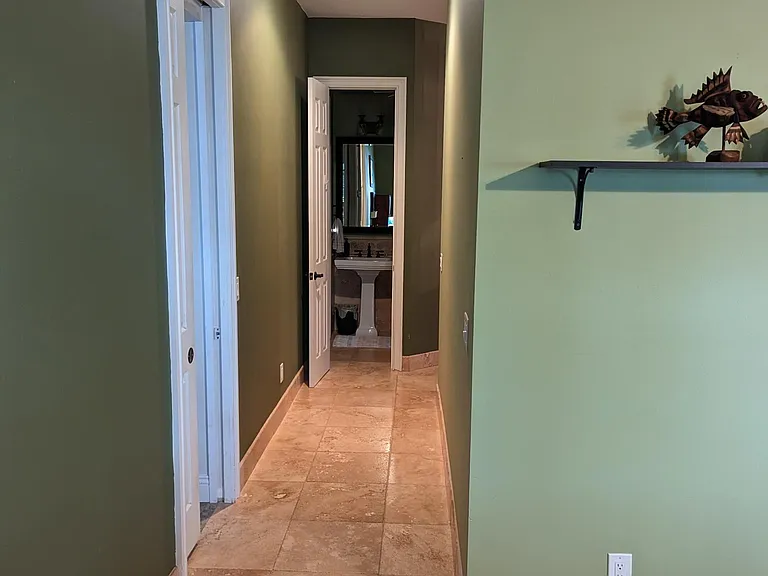 Master Suite entry. When you enter the master suite from the game room, you may head into either the master bedroom or the master bath by way of this corridor.