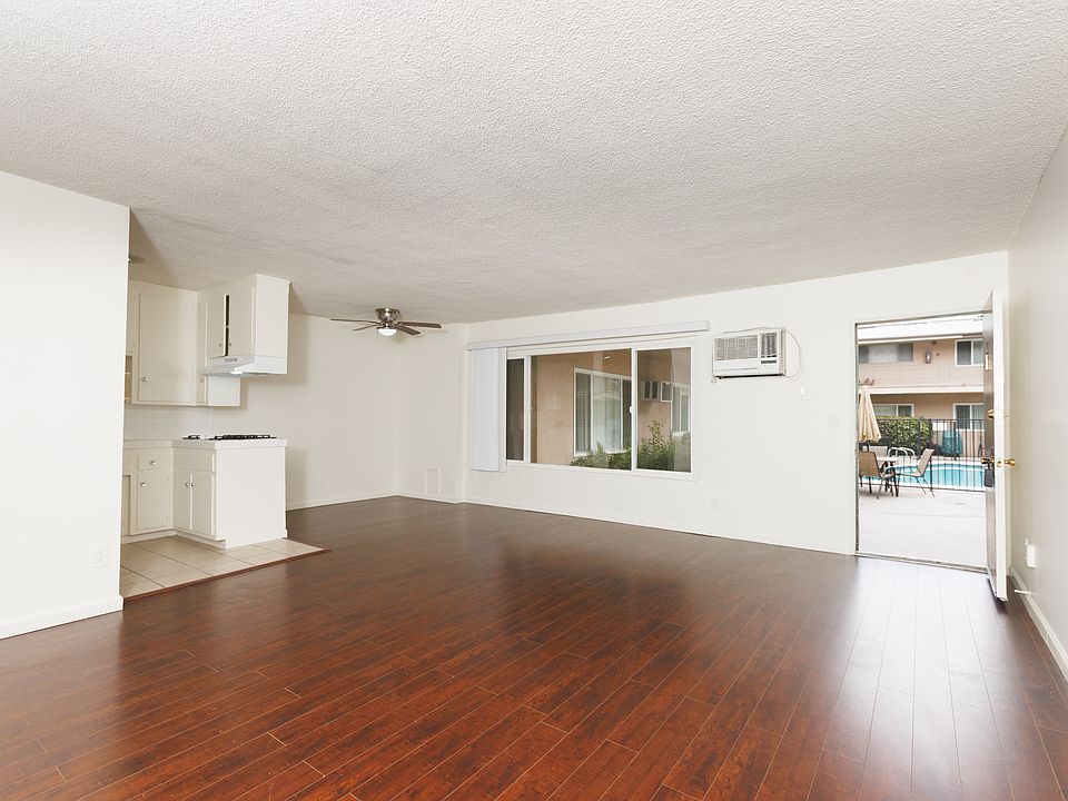 Living Room showing open Front Door
