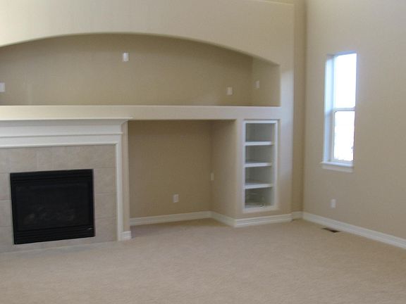 Living room with vaulted ceilings & lots of sunshine