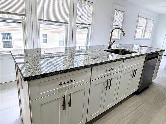 center island with dishwasher and sink