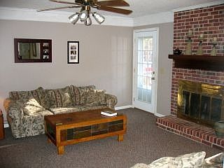 Living Room with Fireplace, Door goes to Deck in backyard
