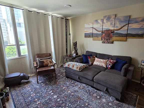 Spacious living room with downtown views