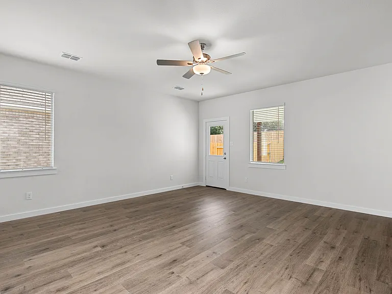The living room has a large window that lets in great, natural light.
