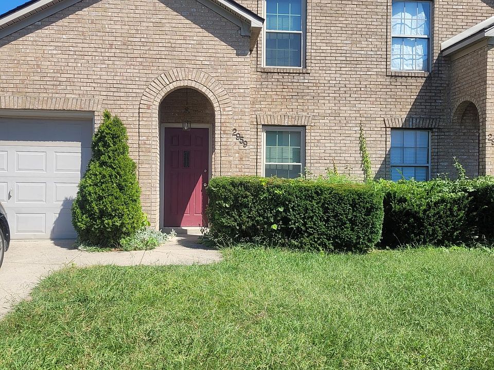 Outside view, room for 2 cars in driveway.