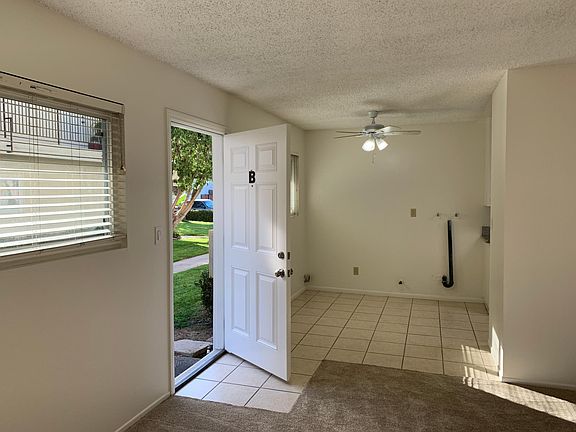 Front door and dining area with washer / dryer hookups.