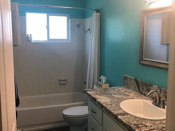 Remodeled cabinets and floor in bathroom