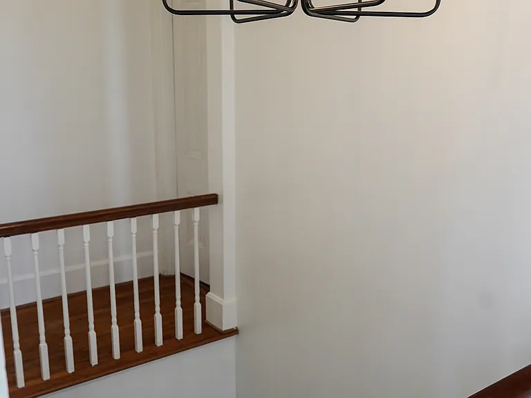 There's one bedroom in the front of the house and one in back, which are accessible from two directions.