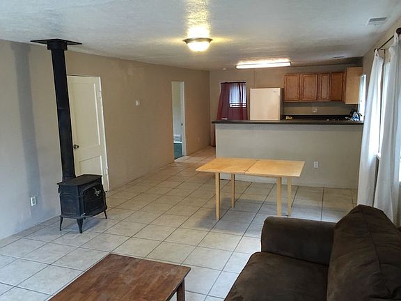 Main space with stove, open kitchen