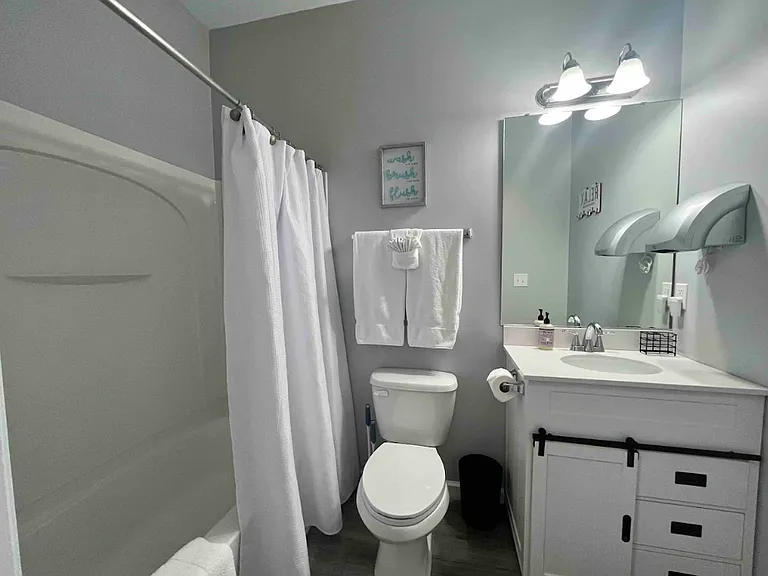 Updated guest bathroom with tub/shower.