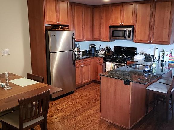 Kitchen with area for dining table.