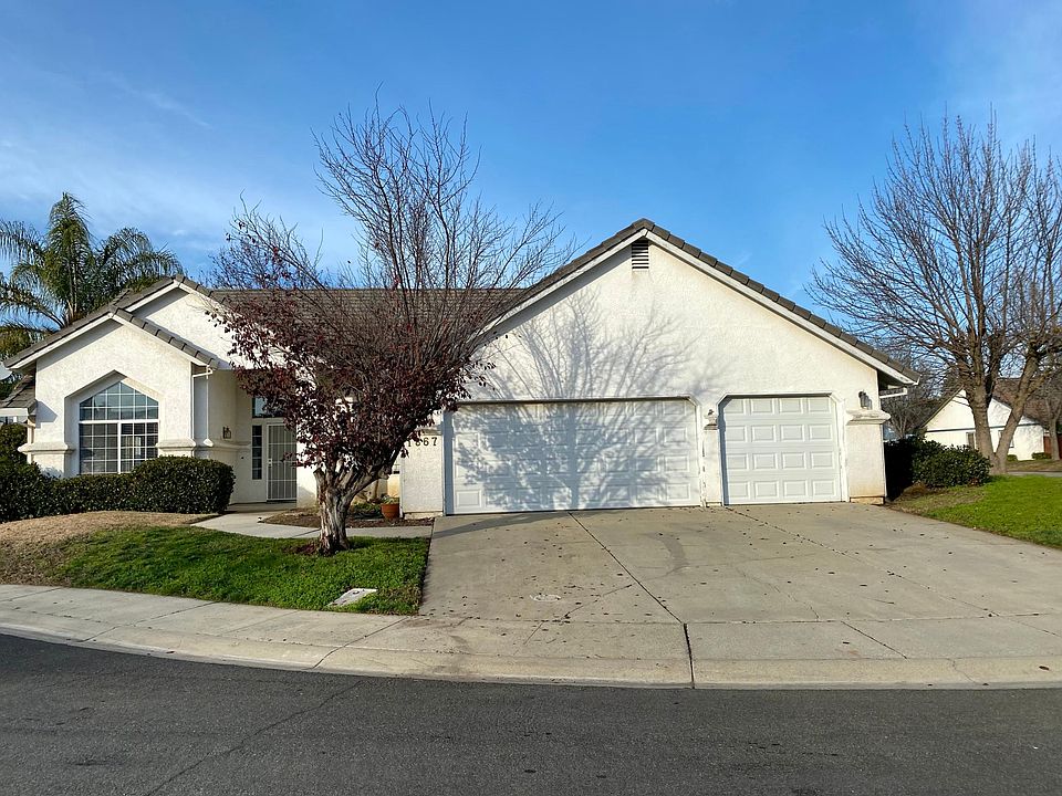 Front of home with three car garage