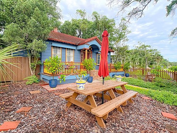 Picnic table in front yard with lake view.