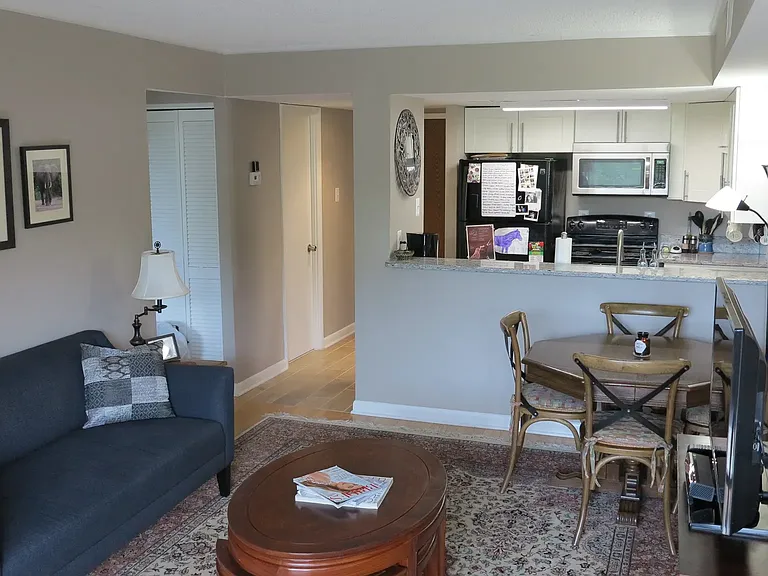 Photo from one of the previous tenant or previous owner to show potential different layout with dining room table