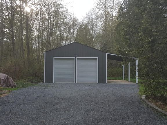576 sf 2 story- double car garage/shop with 228 sf attached carport