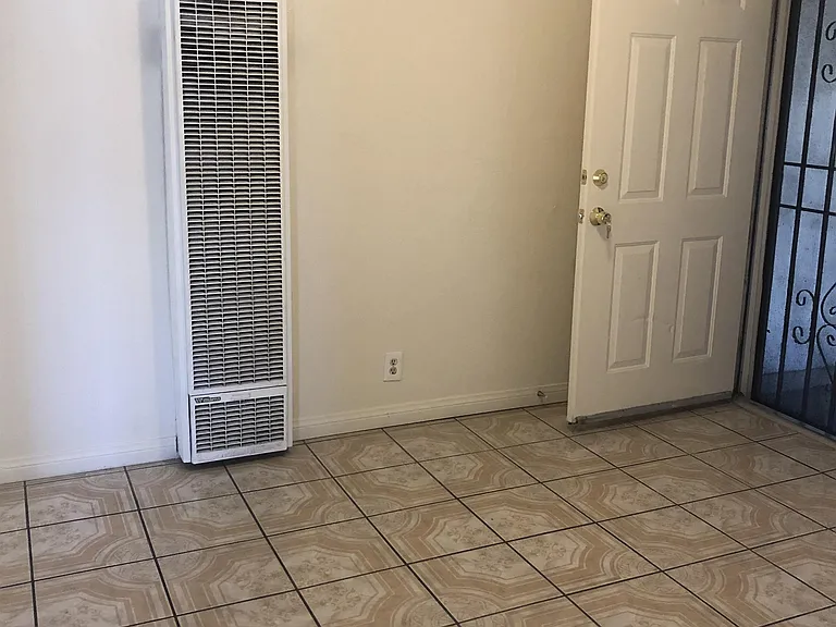 Living room with wall heater.