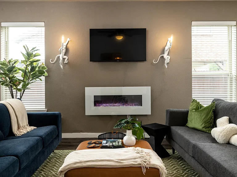 Cozy up by the fireplace and use the 50" Roku Smart TV for movie nights!