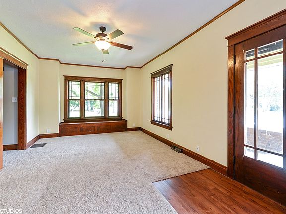Large living room is just off the dining room and has the pillars in-between the 2 rooms with lots o