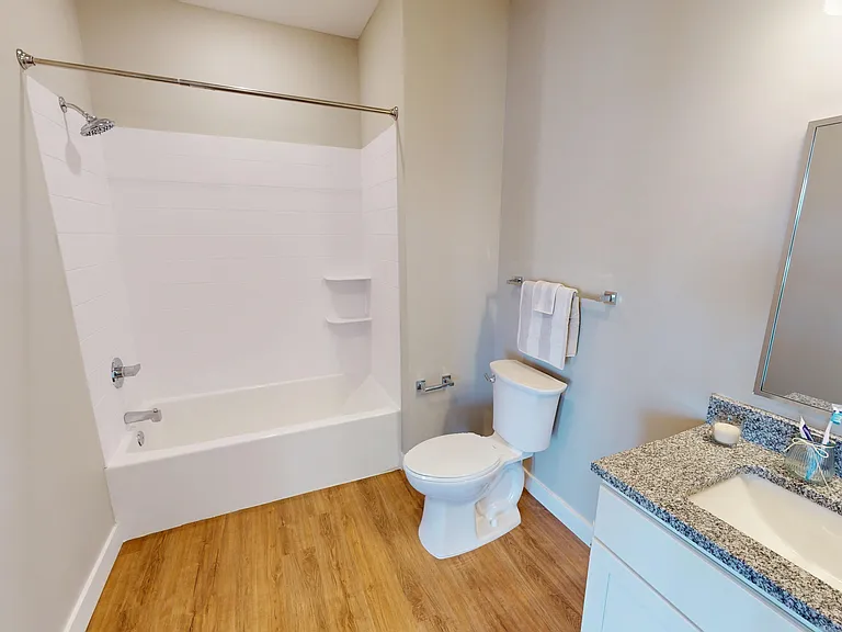 This bathroom gives you options with a clean combo for quick showers or long soaks. This bathroom gives you options with a clean combo for quick showers or long soaks.