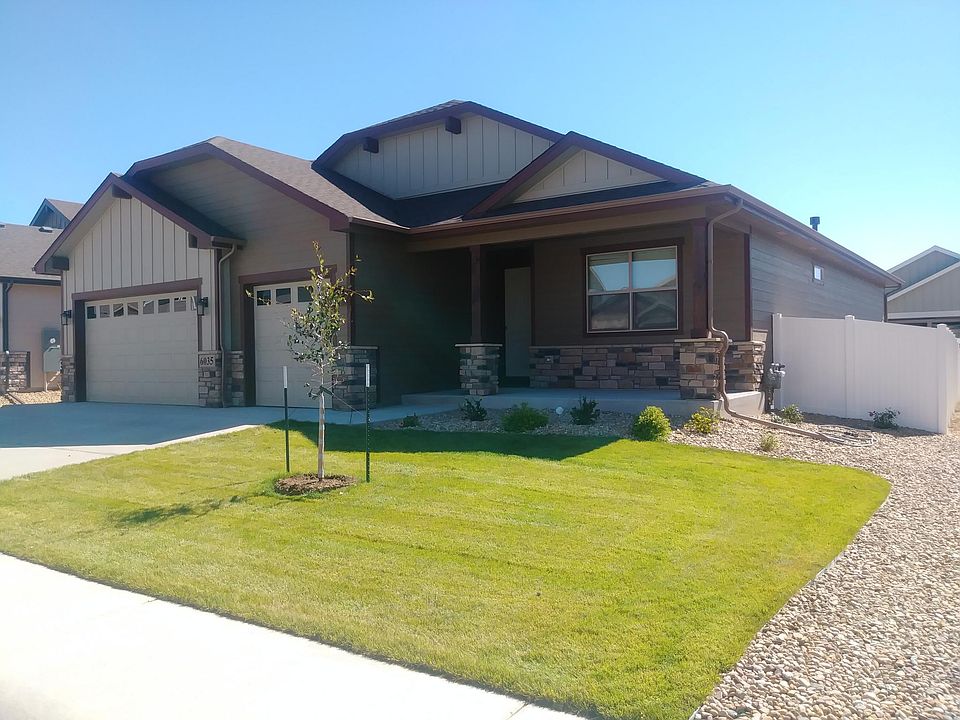 Front- 3 car garage, covered porch and automatic sprinkler s