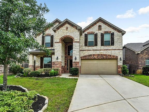 Beautiful Stone and Brick elevation with welcoming Front Porch and covered rear patio.