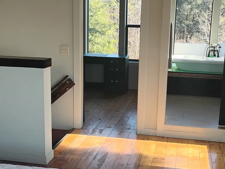 Looking towards the bath on the right and an extra room (yoga room, office, small bedroom, etc) on the left