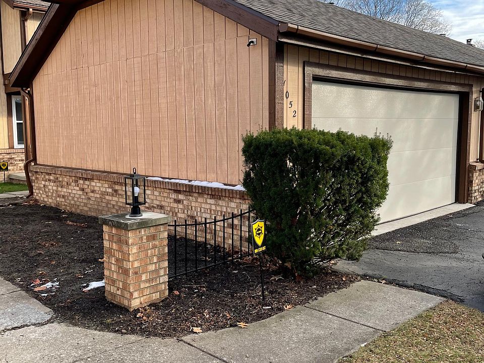 2 Car garage separates unit by only a few feet