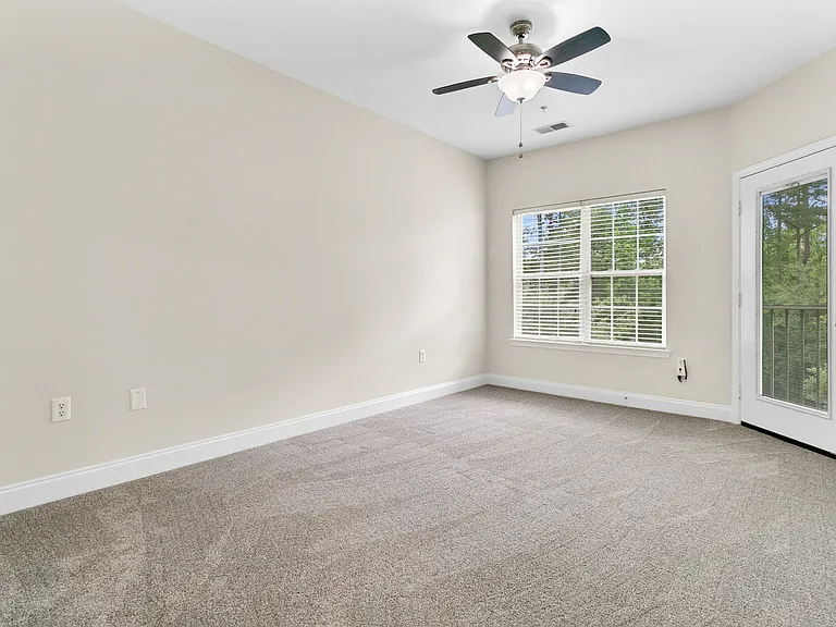2nd bedroom with access door to screened-in porch/balcony