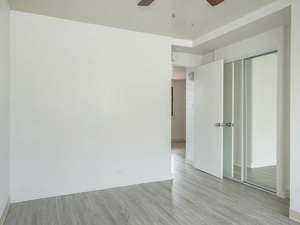 Kapiolani Village bedroom with mirror doored closets