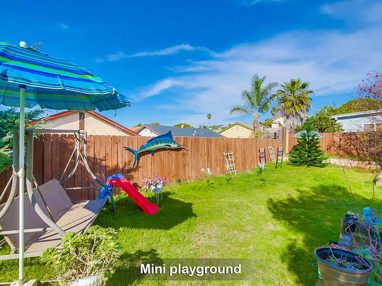 A mini playground in a spacious corner of our backyard is a big hit w/ the little ones